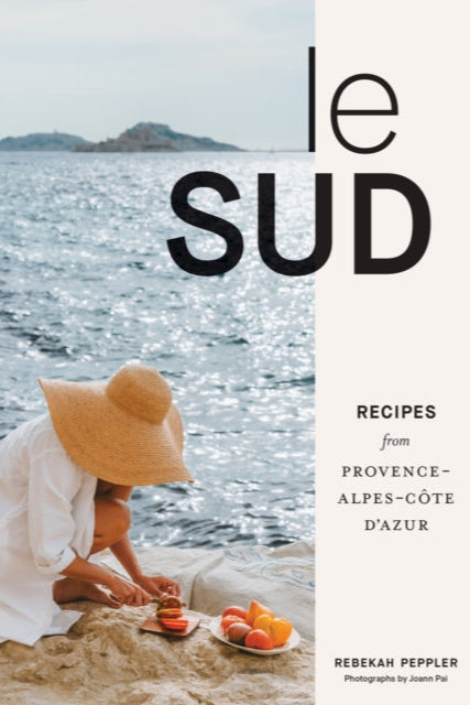 Book cover of 'le SUD' with a person by the sea and text about recipes from Provence-Alpes-Côte d'Azur.