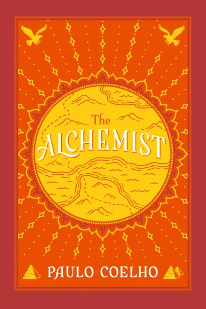 Book cover of 'The Alchemist' by Paulo Coelho with an orange background and yellow text.