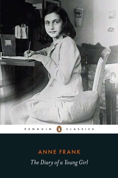 Black and white photo of a young girl sitting at a desk with a book and pen, with 'Penguin Classics' and 'Anne Frank: The Diary of a Young Girl' text.