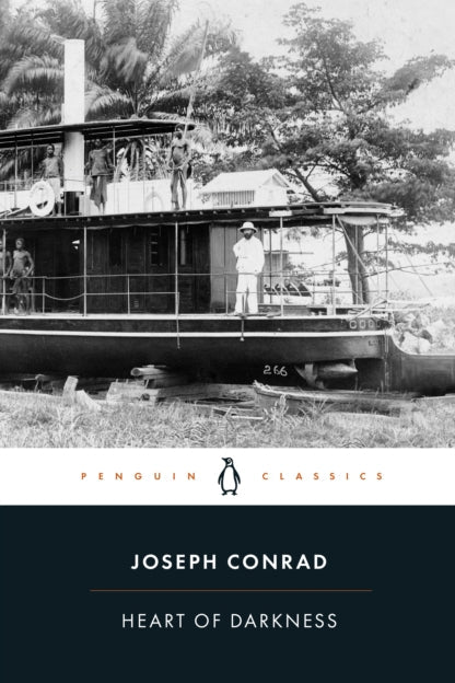 Book cover of 'Heart of Darkness' by Joseph Conrad with a black and white photograph of a boat on a river.