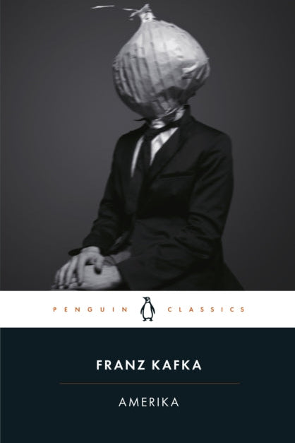 Book cover of 'Amerika' by Franz Kafka with a person wearing an onion helmet against a dark background.