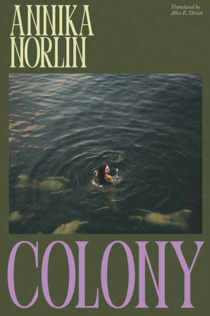 Book cover of 'Colony' by Annika Norlin with a person swimming in water.