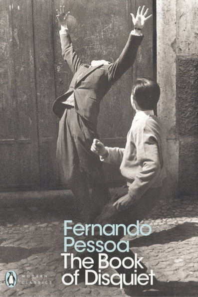 Book cover of 'The Book of Disquiet' by Fernando Pessoa with a black and white photograph of two people on the cover.