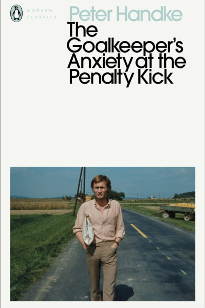 Book cover of 'The Goalkeeper's Anxiety at the Penalty Kick' by Peter Handke with a photo of a man on a road.