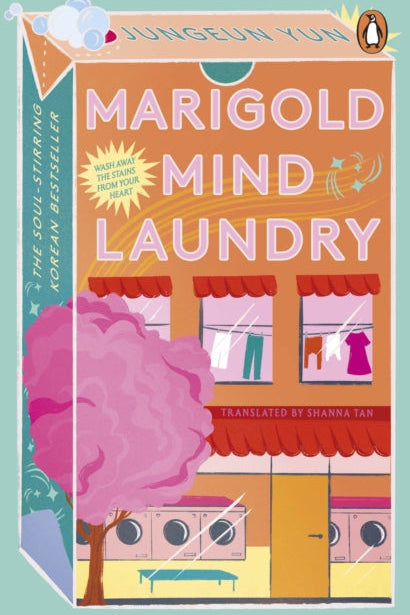 Book cover of 'Marigold Mind Laundry' with a colorful illustration of a laundry shop and tree.