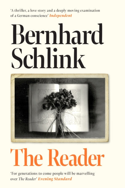 Book cover of 'The Reader' by Bernhard Schlink with a black and white photo of flowers on text.
