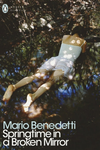 Book cover of 'Springtime in a Broken Mirror' by Mario Benedetti with a person lying on the ground.