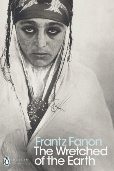 Book cover of 'The Wretched of the Earth' by Frantz Fanon featuring a black and white portrait.